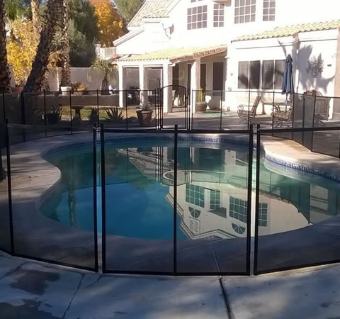 black fence installed on swimming pool